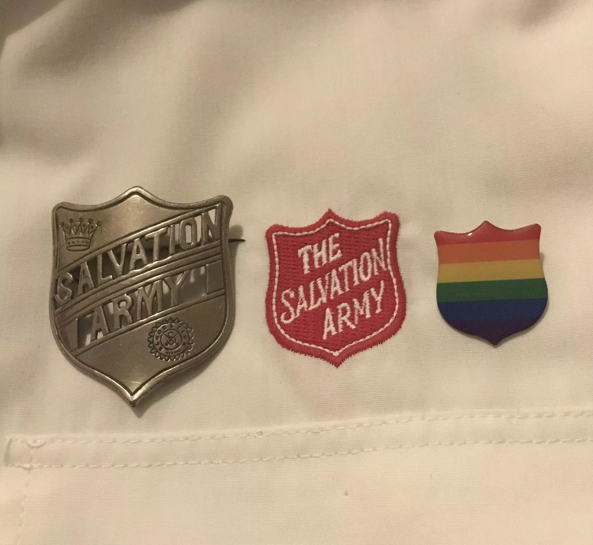 Salvation army shields, metal, red fabric, rainbow